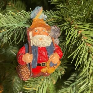 Festive Santa Claus Ornament with Blue and Red Accents